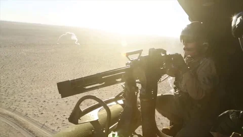 Operator Drive heavy fire from Minigun on target Stock Footage 120844137