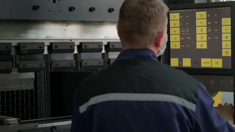 Operator is entering a Code on a Machine Control Panel then set a Timer. Stock Footage 152346315