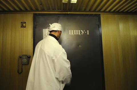 Operator entering the door to the control operations room of the Chernobyl Nu Stock Photos