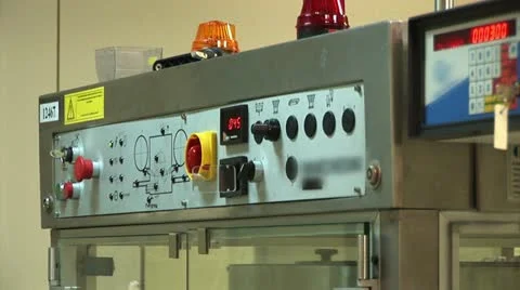 The operator enters data to the automatic conveyor for the production of drugs Stock Footage 22225781