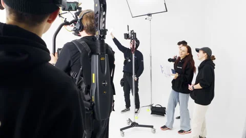 Operator equipped with Steadicam starts capturing scene Stock Footage 303064329