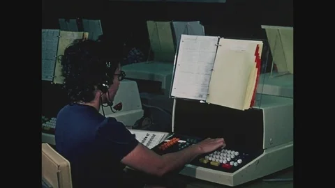Operator in front of computer screen at Off Track Betting OTB taking telephone Stock Footage 82549917