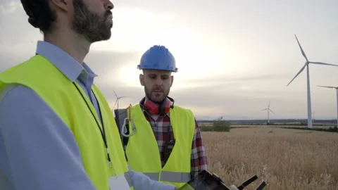 Operator hands holding remote control and quad copter. Engineers controlling Stock Footage 240083975