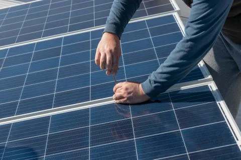 Operator installing solar equipment in residence Stock Photos
