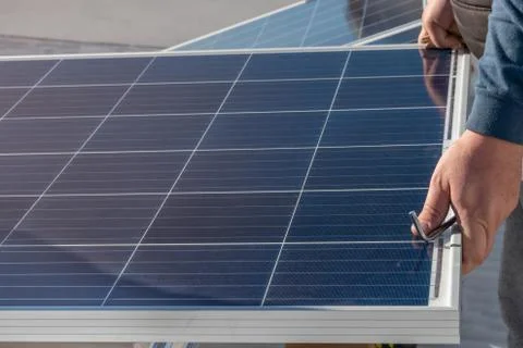 Operator installing solar equipment in residence Stock Photos