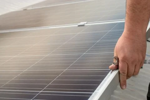 Operator installing solar equipment in residence Stock Photos