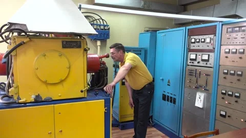 Operator of Ionic-Plasma Deposition System Controls a Workflow Stock Footage 91666663