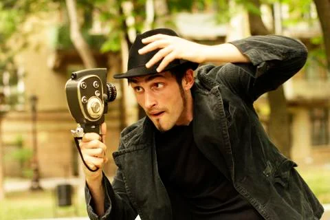 Operator looks at the old camera   Stock Photos