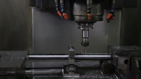 Operator machining automotive part by cnc turning machine Stock Footage 220698968