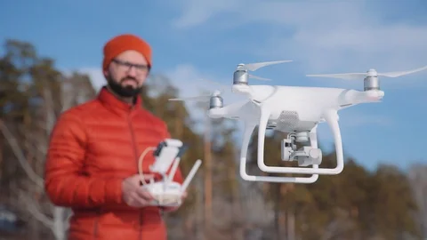Operator makes an areial photo using a drone. Copter in winter Stock Footage