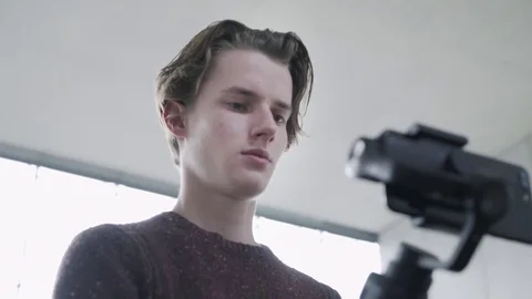 The operator makes a video shoot for his Internet channel using a stabilizer and Stock-Footage 81042057