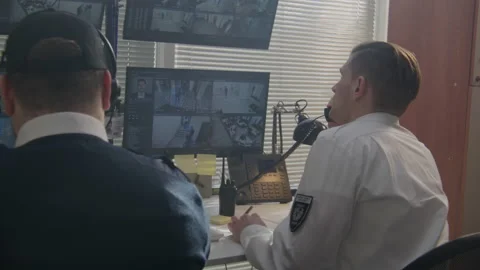 Operator monitors CCTV cameras in observation room Stock Footage 237217507