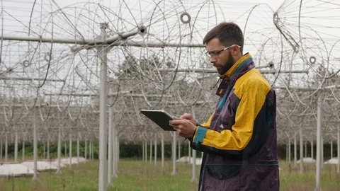 Operator monitors communication equipment. Array solar radio telescope Stock Footage 107371335