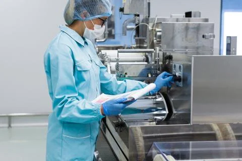 The operator monitors the operation parameters of the machine Stock Photos