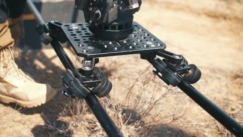 The operator moves the video camera along the slider. Film crew. Stock Footage 318541523