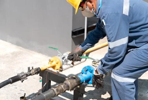Operator open liquid valve for recieve gas to tank. Stock Photos