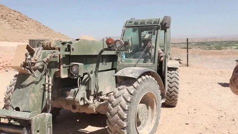 Operator operate heavy equipment at Forward Operating Base Whitehouse - 2012 Stock Footage 104298345