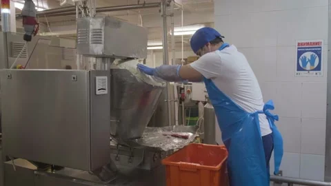 The operator pours the curd into the mixing machine 스톡 동영상 161510522