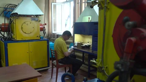 Operator Prepares Dental Prostheses for Ionic-Plasma Deposition with Gold Stock Footage 91666464