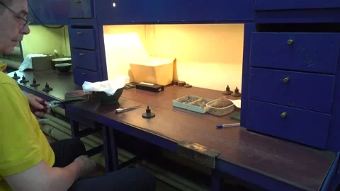 Operator Prepares Dental Prostheses for Ionic-Plasma Deposition with Gold Stock Footage 91666485