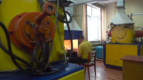 Operator Prepares Dental Prostheses for Ionic-Plasma Deposition with Gold Stock Footage 91666550