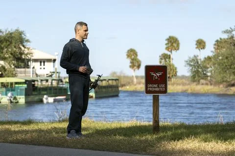 Operator is preparing to fly his quadcopter in national park no drone area... Stock Photos