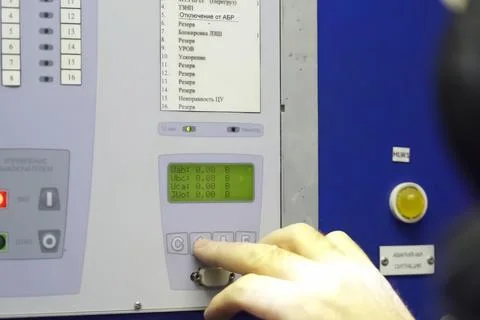 The operator presses the button to control the parameters of the LNG compress Stock Photos