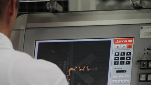 Operator programming Jorns Twin Matic folding machine control panel 库存影片 317253902