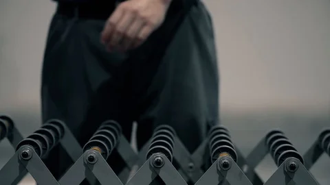 An operator pushes a package on the packaging line in a warehouse. The parcel mo Stock Footage 128295045