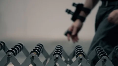 An operator pushes a package on the packaging line in a warehouse. The parcel mo Stock Footage 128295049