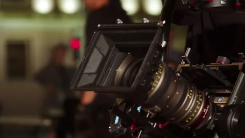 Operator raises sturdy stabilized rig holding mounted camera Stock Footage 321946118