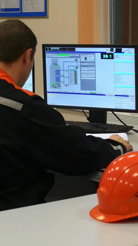 Operator records equipment performance and monitors data on screens to ensure Stock Footage 287615856
