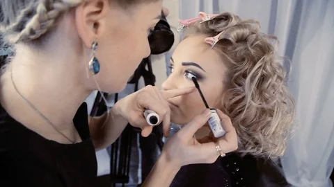 The operator removes the camera makeup on the girl Stock Footage 95278069