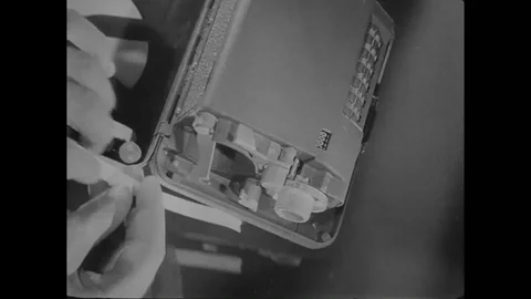 Operator rolls tape over the Converter M-209-B machine - 1940 스톡 동영상 108041592