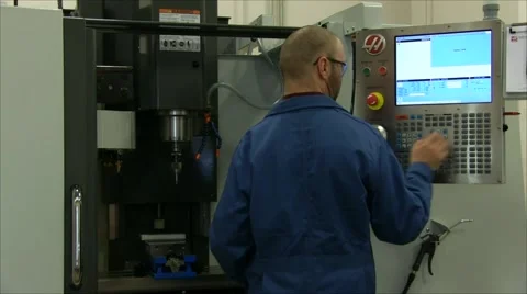 Operator Sets Up Milling Machine Stock Footage 57464338