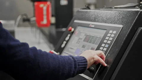 The operator sets program for computer numerical control, presses touch screen Stock Footage 166826068