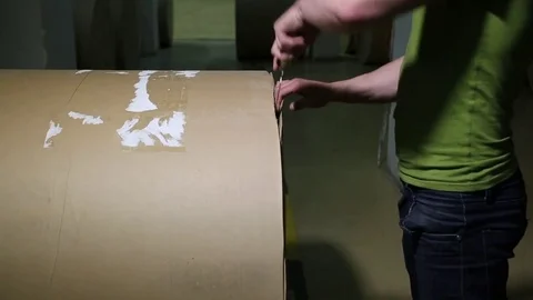 The operator sets up a roll of newsprint in the printing press. Print the newspa Stock-Footage 75451934