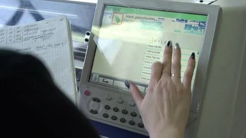 Operator setting knitting machine programme view Stock Footage 87120337