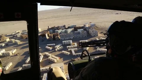 The operator shoots from a minigun on a model of the city, the training process Stock Footage 120844076