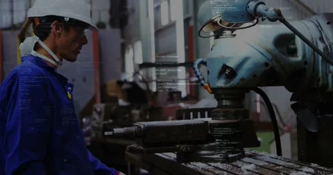 Operator starting cycle in plant, watching spindle cutting part while code Stock-Footage 331006208