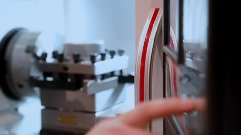 Operator Starting Industrial Lathe Machine by Pressing Control Button Stock Footage 347182595