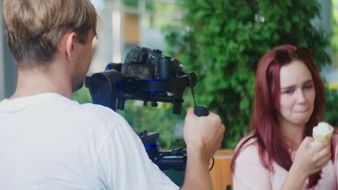 Operator with Steadicam recording video. 4k, operator shoots a video of a girl Видео 94771388