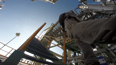 Operator on structure of industrial refining plant Stock Footage 38841168