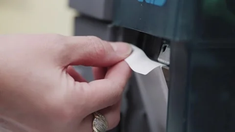 Operator take printed label extracted from a modern industrial printer Stock Footage 331248051