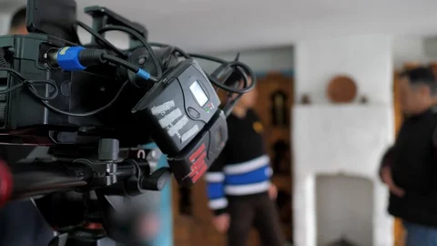 The operator takes on camera the reportage. TV cam streaming Stock Footage 124703856