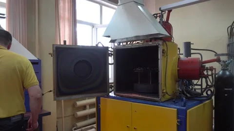 Operator Turning on an Old Ionic-Plasma Deposition System Stock Footage 91666590