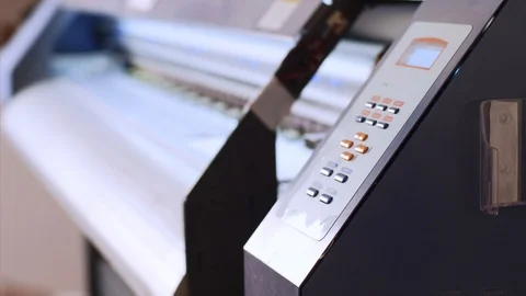 Operator turns on printing process of inkjet printing press with ciss system. Stock Footage 114609700