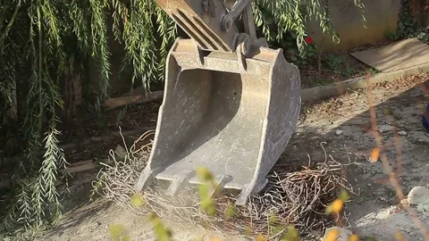 Operator turns scrap rebars into rolls in a demolition site Video stock 72216414