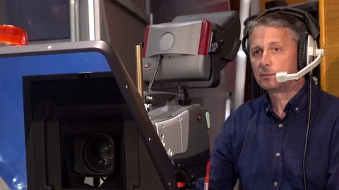 Operator on TV. the operator works with a cinema TV broadcast camera Stock Footage
