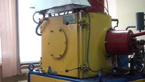 Operator Unloads the Dental Prosthesis from an Ionic-Plasma Deposition System Stock Footage 91666690